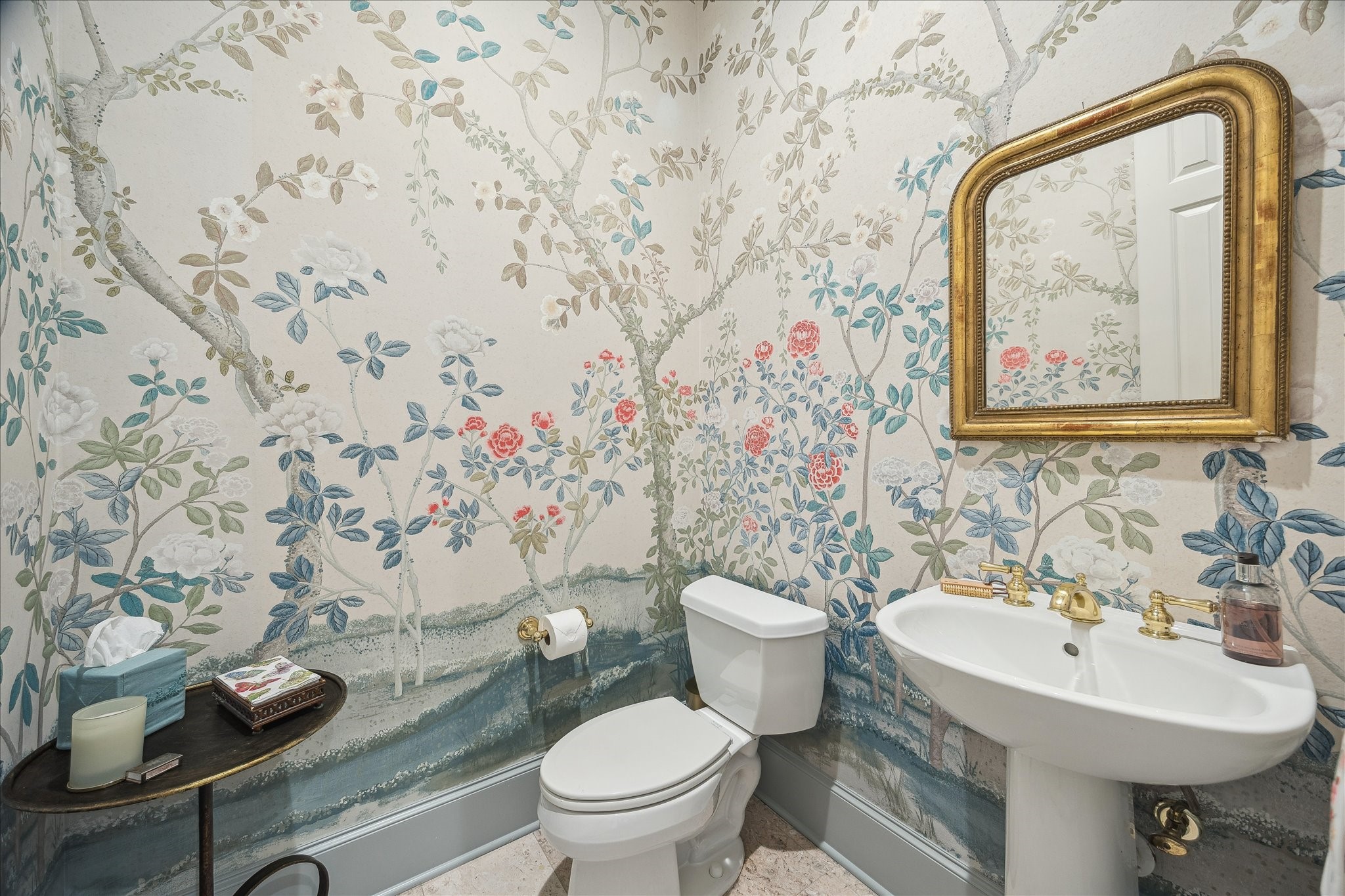 11524 Taylorcrest Road Houston, TX 77024 - Photo 24 of 47 The formal first-floor powder bath is beautifully appointed with Schumacher wallpaper, a pedestal sink, and brass fixtures.
