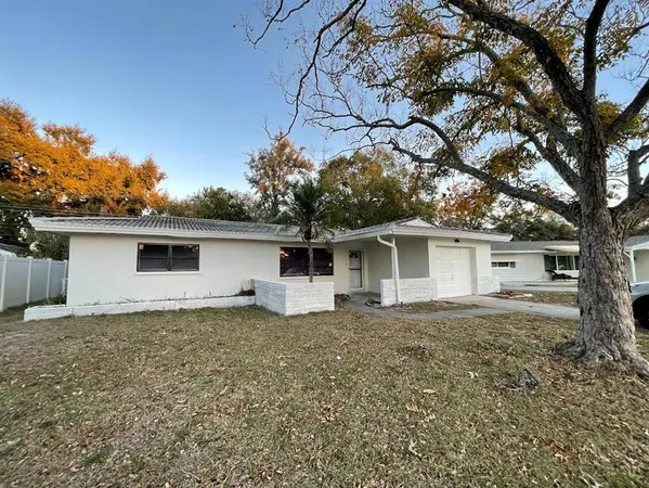 front view of a house with a yard