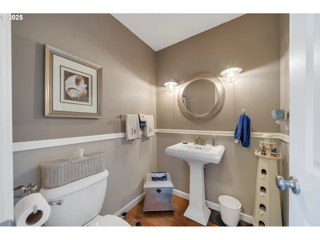 a bathroom with a sink mirror and vanity