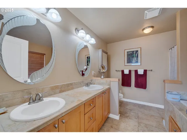 a bathroom with a sink double vanity and a mirror