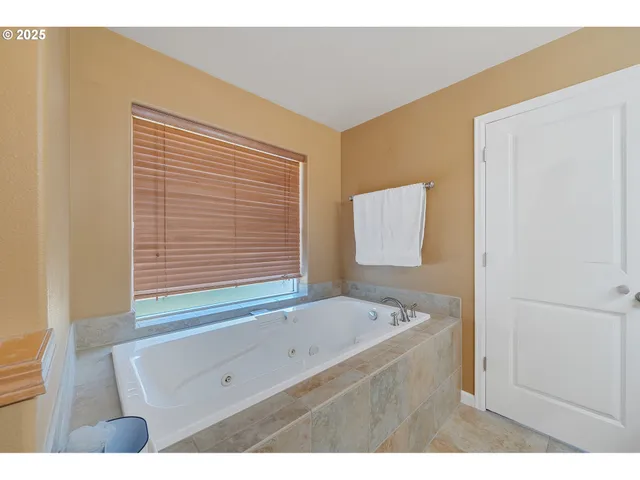 a bathroom with a bathtub and a sink