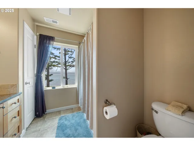 a bathroom with a toilet sink and tub