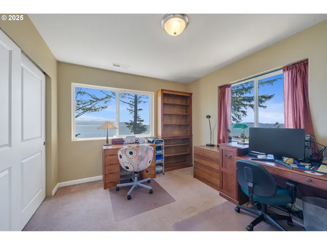 a workspace with furniture and a window