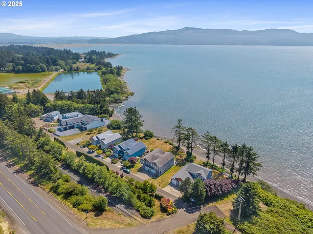 an aerial view of a house with a lake view