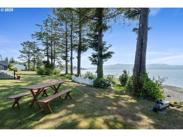 a view of backyard with a table and chairs
