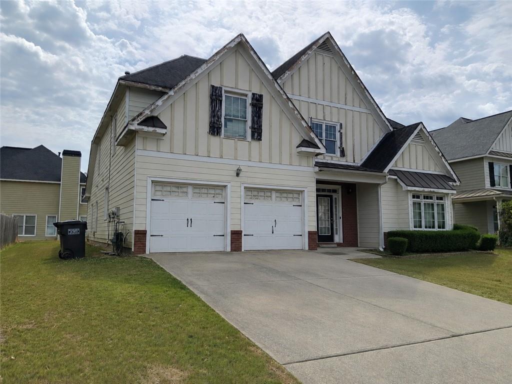 55 Harrison Circle Covington, GA 30016 - Photo 2 of 9 a front view of a house with a yard