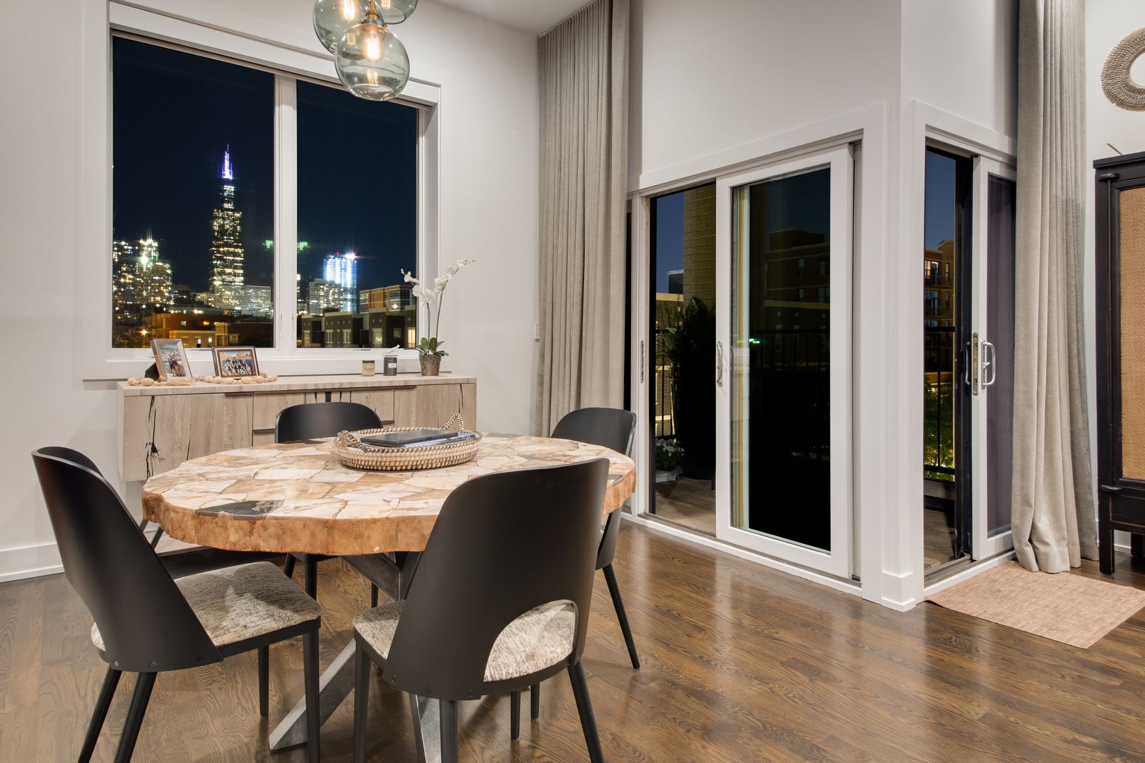 6 North Throop Street, Unit 4S Chicago, IL 60607 - Photo 11 of 31 a dining room with furniture a chandelier and wooden floor