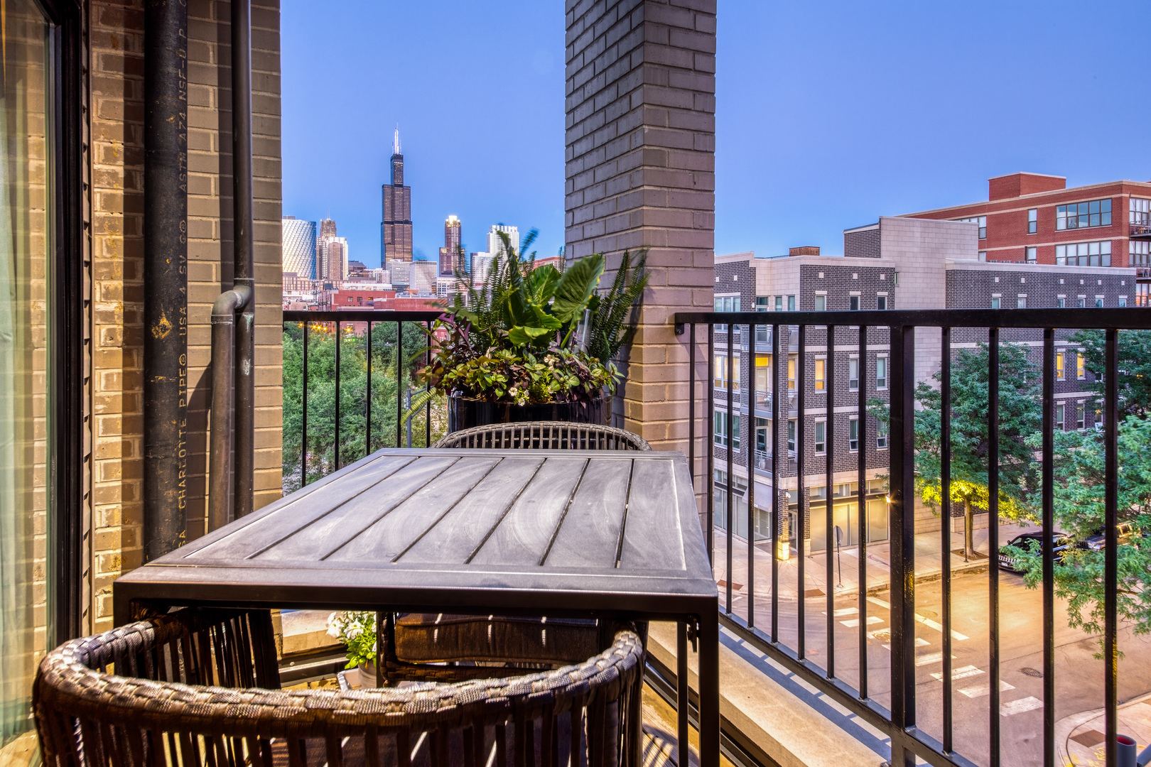 6 North Throop Street, Unit 4S Chicago, IL 60607 - Photo 30 of 31 a table and chairs sitting in front of a balcony