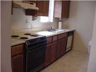 803 Valley Road, Unit 803 Crestview, FL 32539 - Photo 5 of 5 a kitchen with a stove and a sink