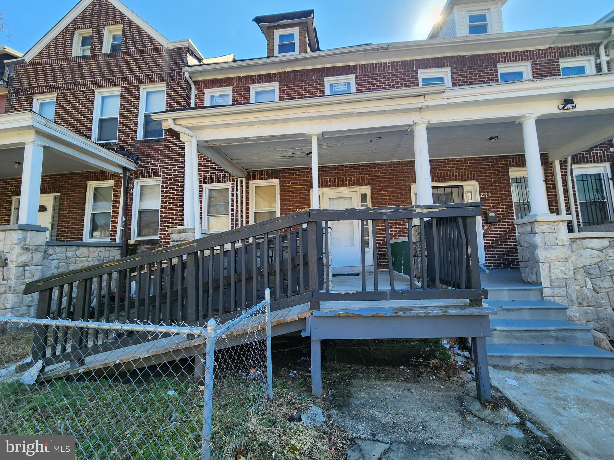 2217 Bryant Avenue Baltimore, MD 21217 - Photo 1 of 31 a view of a house with wooden deck and furniture