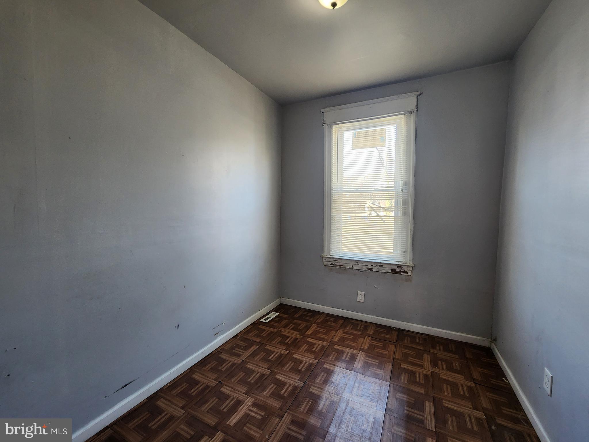 2217 Bryant Avenue Baltimore, MD 21217 - Photo 19 of 31 a view of a room with wooden floor and window