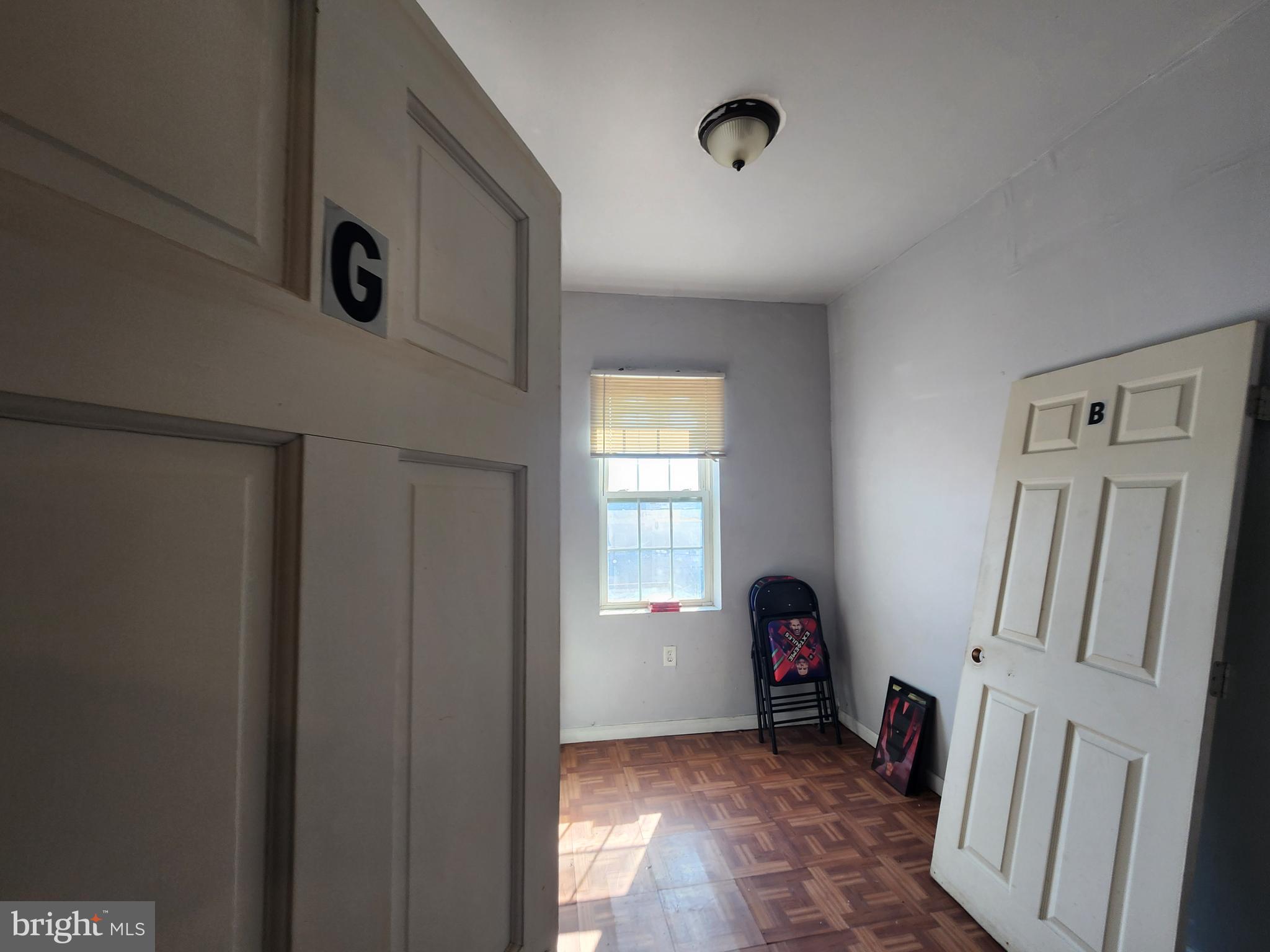2217 Bryant Avenue Baltimore, MD 21217 - Photo 23 of 31 a view of livingroom with hardwood floor and staircase