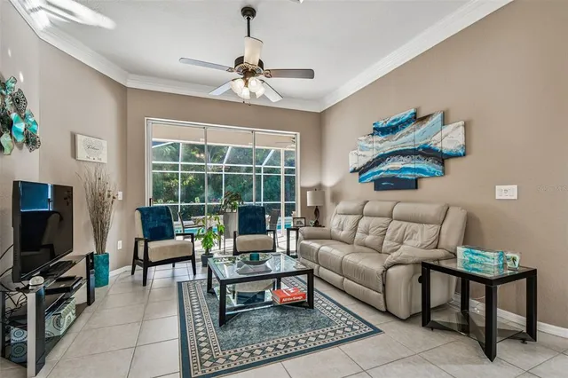 a kitchen with stainless steel appliances kitchen island granite countertop a refrigerator a stove a oven a sink with island chairs and wooden cabinets