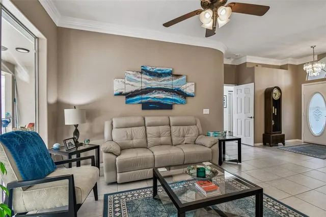 a kitchen with stainless steel appliances kitchen island granite countertop a stove top oven a refrigerator a sink and chairs with wooden floor