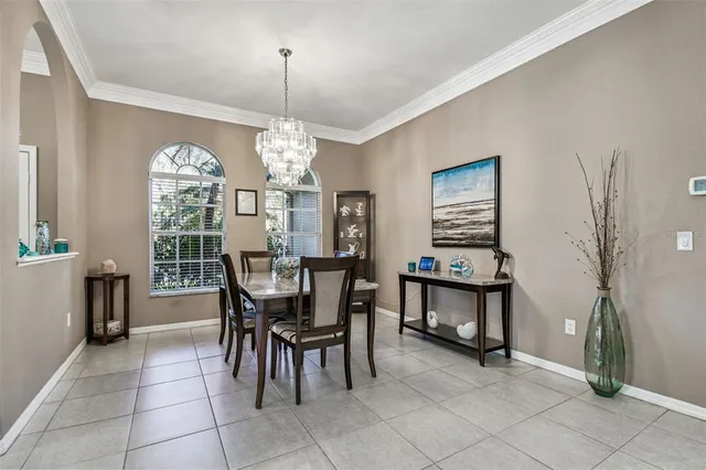 a kitchen with stainless steel appliances a stove center island a refrigerator and wooden cabinets