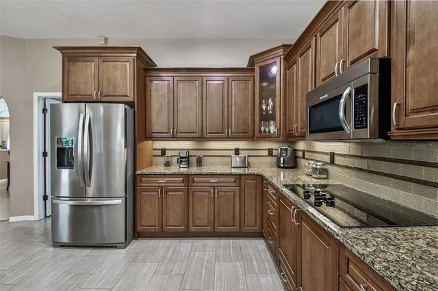 a bathroom with a double vanity sink a mirror and a bathtub