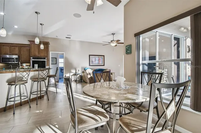 a bedroom with a bed and painting on the wall
