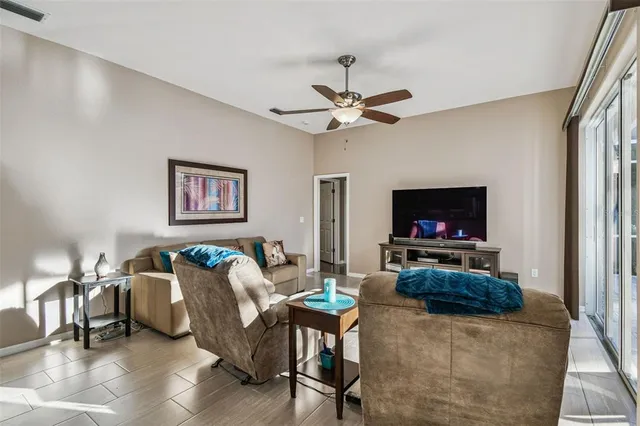 a bedroom with a bed and a lamp