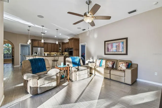 a bedroom with a large bed and a tv