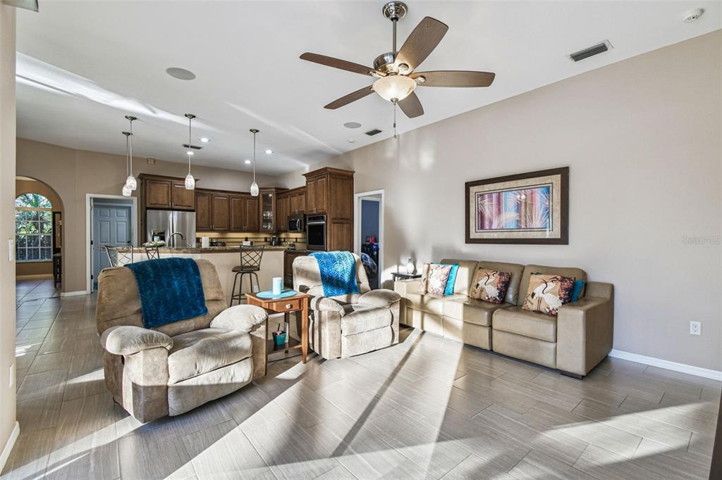 1955 Dunloe Circle Dunedin, FL 34698 - Photo 36 of 94 a living room with furniture and kitchen view
