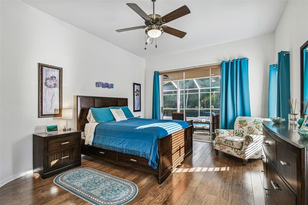 1955 Dunloe Circle Dunedin, FL 34698 - Photo 38 of 94 a bedroom with a bed and a couch