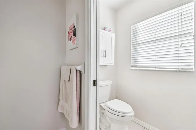 an aerial view of residential houses with outdoor space and street view