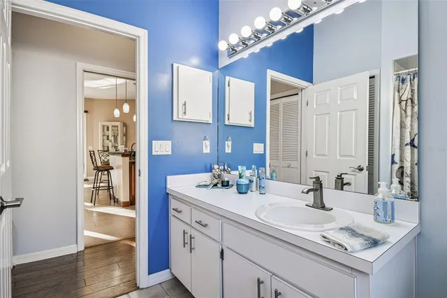 an aerial view of residential houses with outdoor space and trees