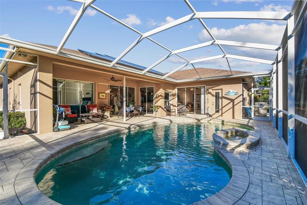 1955 Dunloe Circle Dunedin, FL 34698 - Photo 70 of 94 a view of a swimming pool with a patio