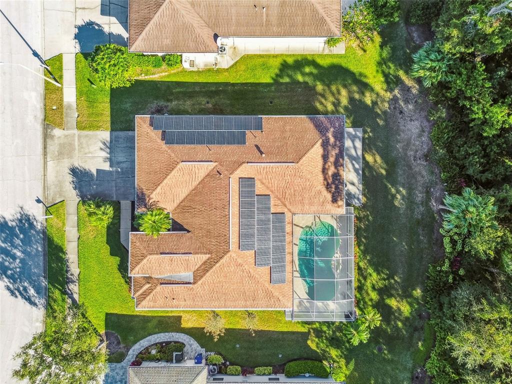 1955 Dunloe Circle Dunedin, FL 34698 - Photo 83 of 94 an aerial view of a house with a garden