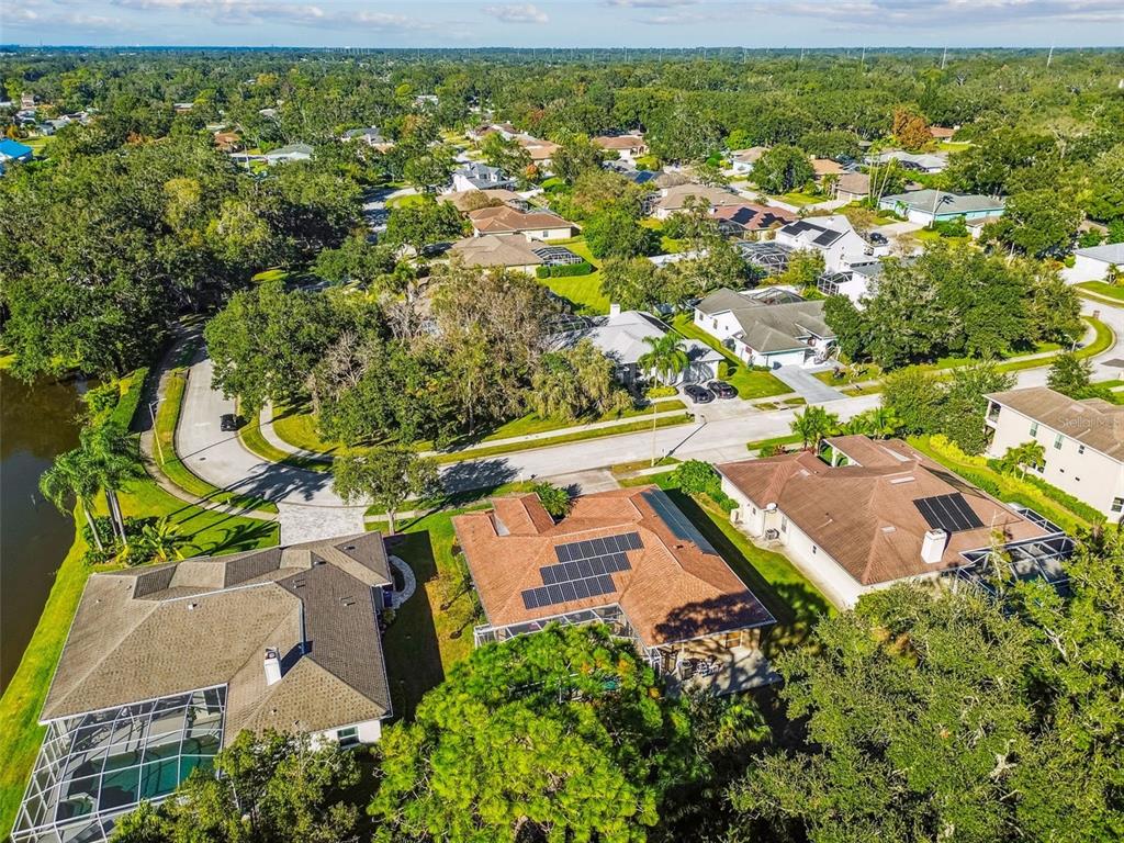 1955 Dunloe Circle Dunedin, FL 34698 - Photo 84 of 94 an aerial view of residential houses with outdoor space and street view