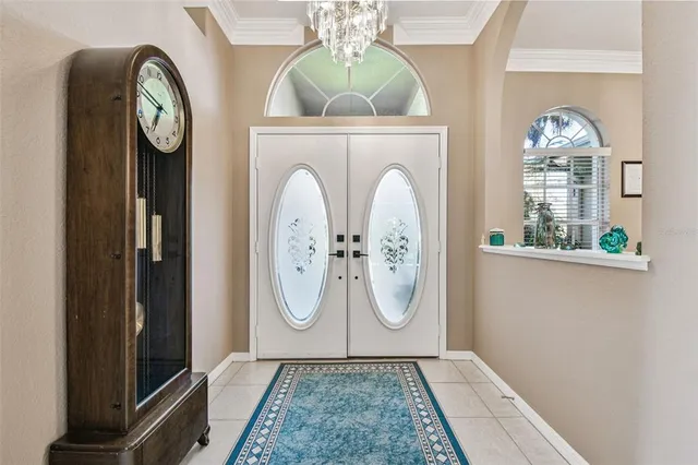 a kitchen with stainless steel appliances kitchen island granite countertop a stove a sink a oven and a refrigerator