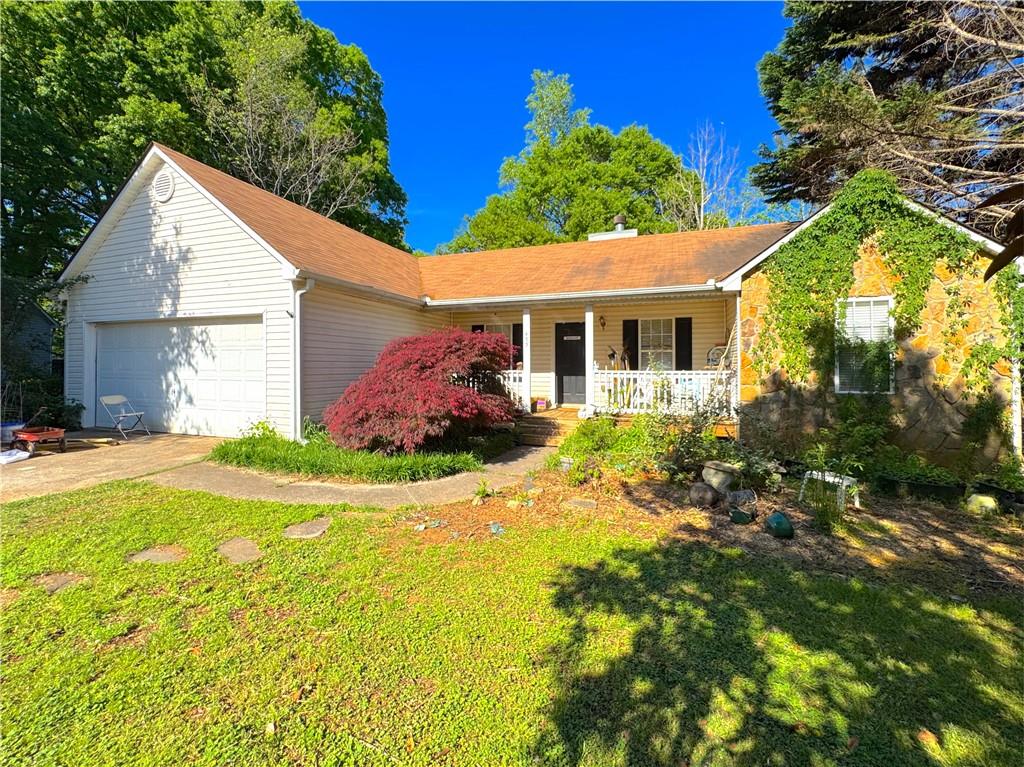 435 Red Oak Court Monroe, GA 30655 - Photo 1 of 28 a view of a house with pool and garden