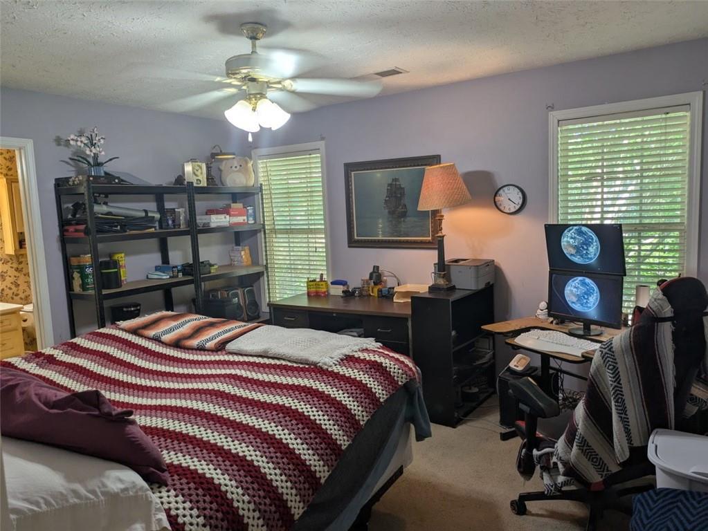 435 Red Oak Court Monroe, GA 30655 - Photo 12 of 28 a bedroom with a bed and a large window with the outer view