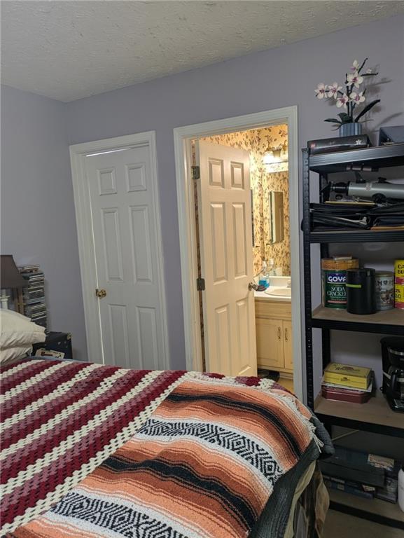 435 Red Oak Court Monroe, GA 30655 - Photo 13 of 28 a bedroom with a bed and a window
