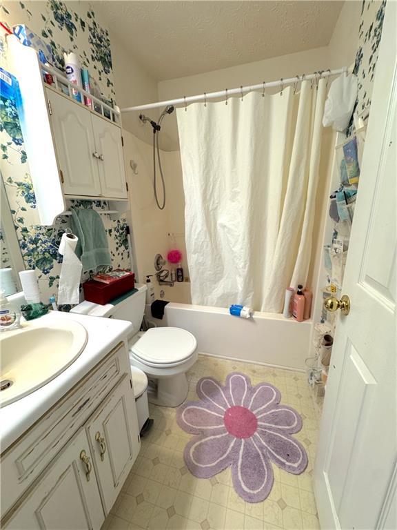 435 Red Oak Court Monroe, GA 30655 - Photo 15 of 28 a bathroom with a sink a toilet and shower curtain