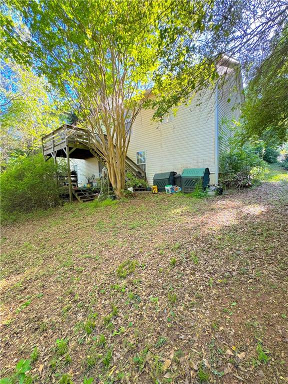 435 Red Oak Court Monroe, GA 30655 - Photo 17 of 28 a backyard of a house with lots of green space