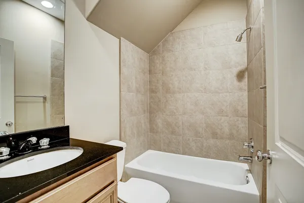 a bathroom with a sink a toilet and a bathtub