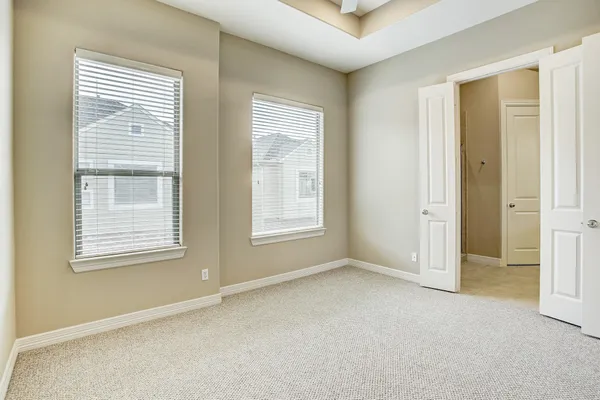 a view of an empty room with a window