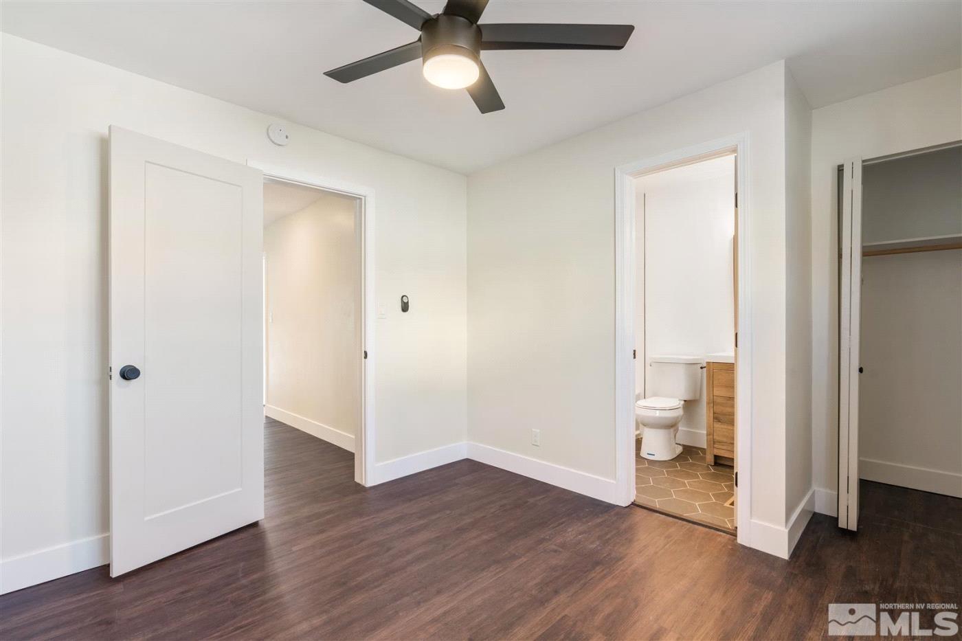 289 Bartlett Street Reno, NV 89512 - Photo 18 of 40 a view of a room with wooden floor and bathroom view