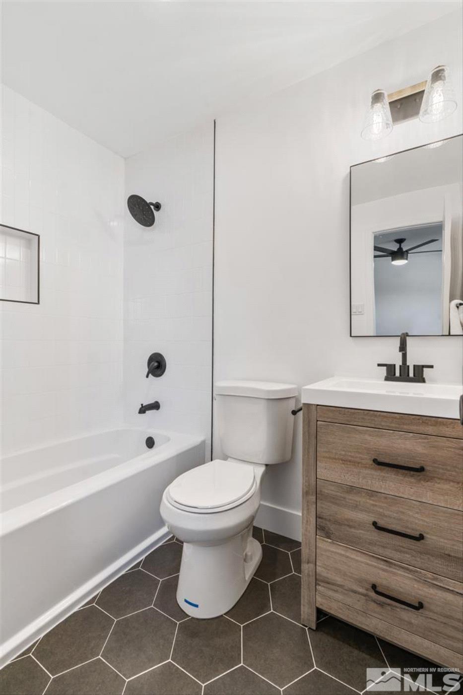 289 Bartlett Street Reno, NV 89512 - Photo 19 of 40 a bathroom with a sink toilet and shower