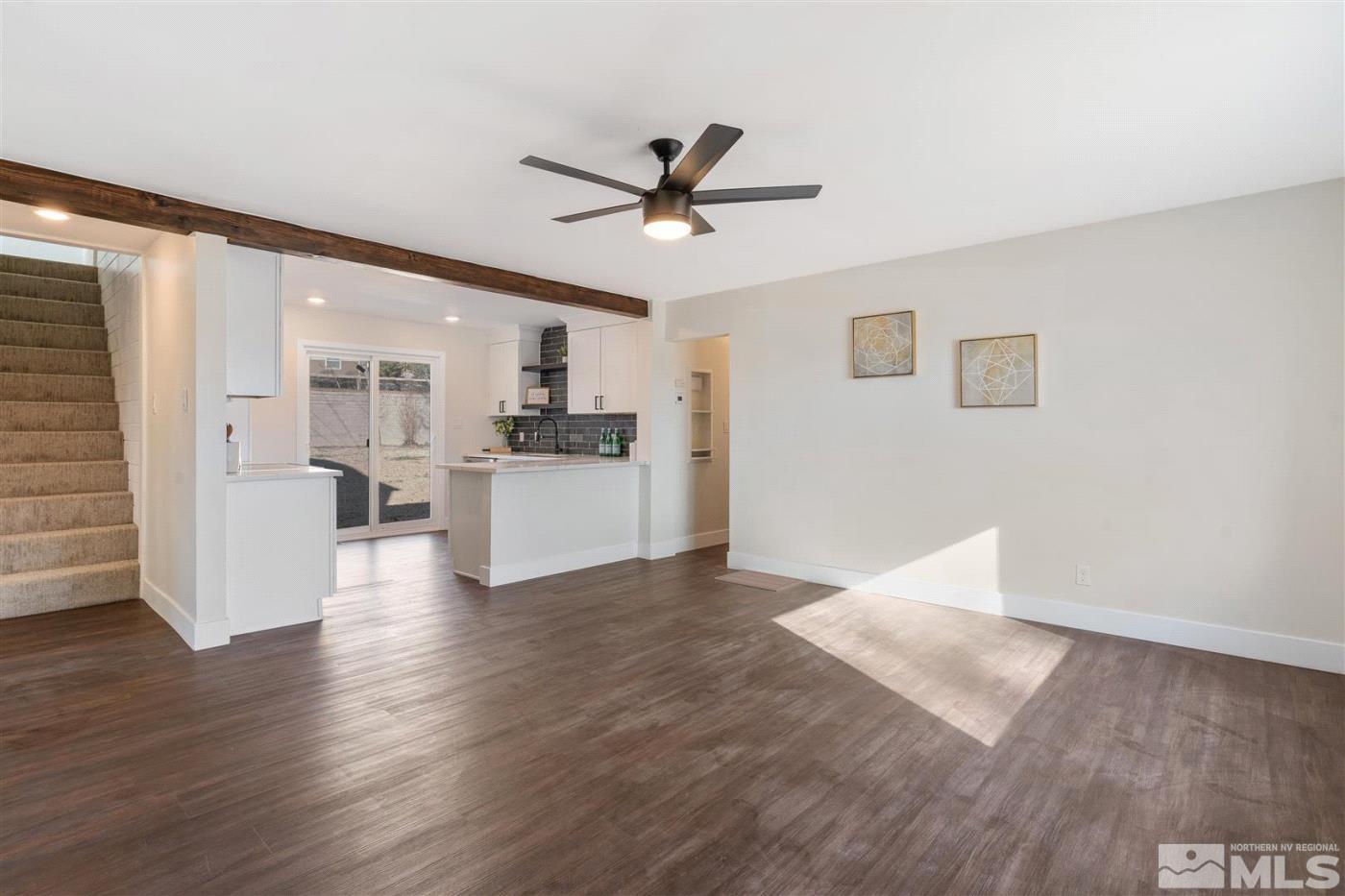 289 Bartlett Street Reno, NV 89512 - Photo 2 of 40 a view of a kitchen with a sink a refrigerator and wooden floor