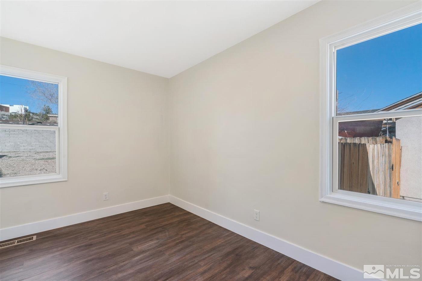 289 Bartlett Street Reno, NV 89512 - Photo 22 of 40 a view of a small space with wooden floor and a window
