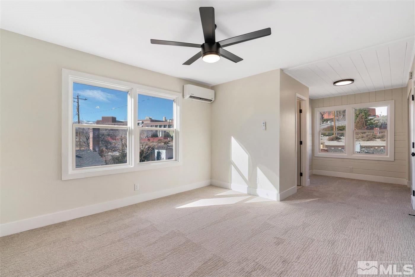 289 Bartlett Street Reno, NV 89512 - Photo 30 of 40 a view of livingroom with furniture ceiling fan and window