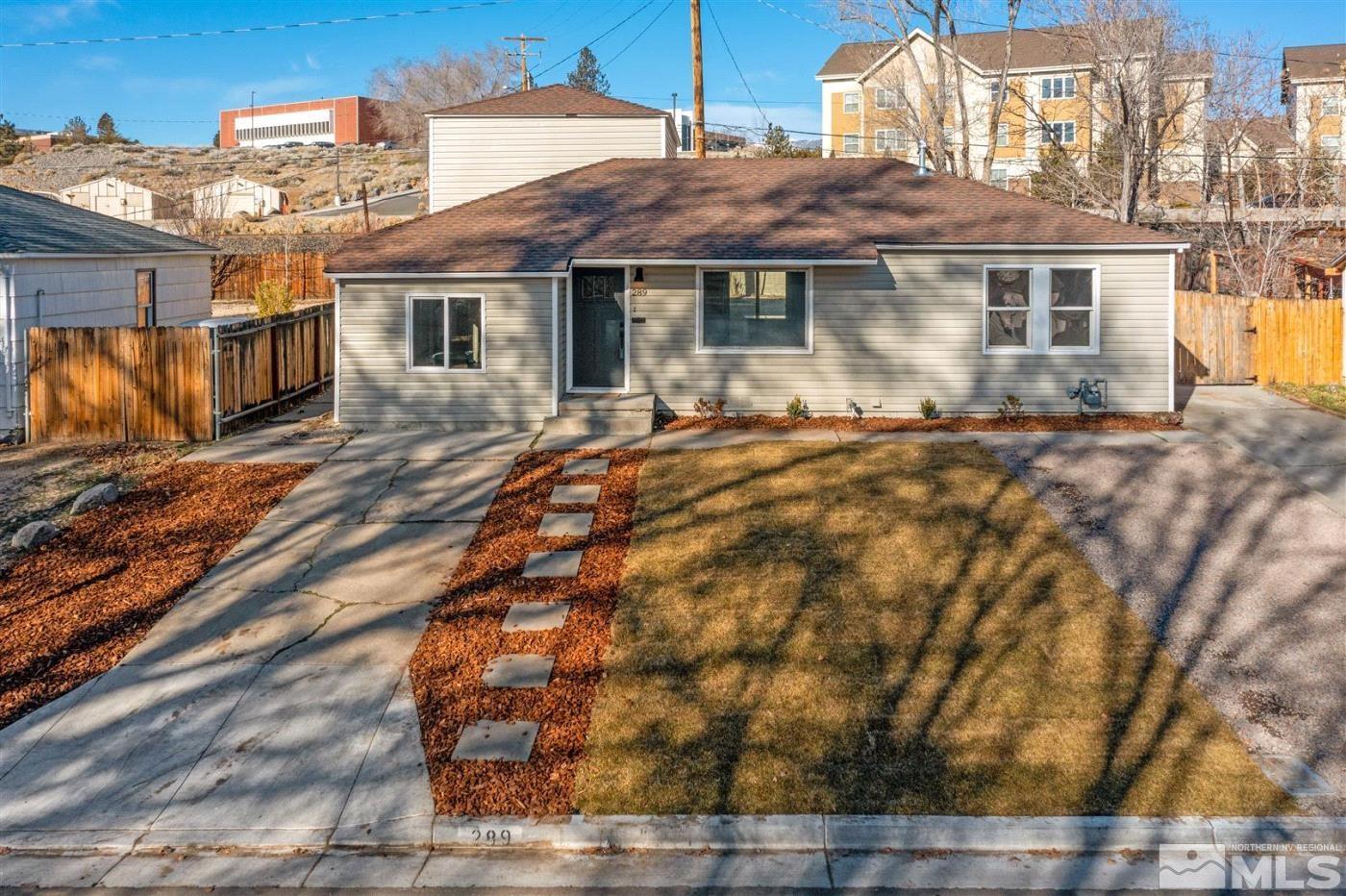 289 Bartlett Street Reno, NV 89512 - Photo 36 of 40 a front view of a house with a yard