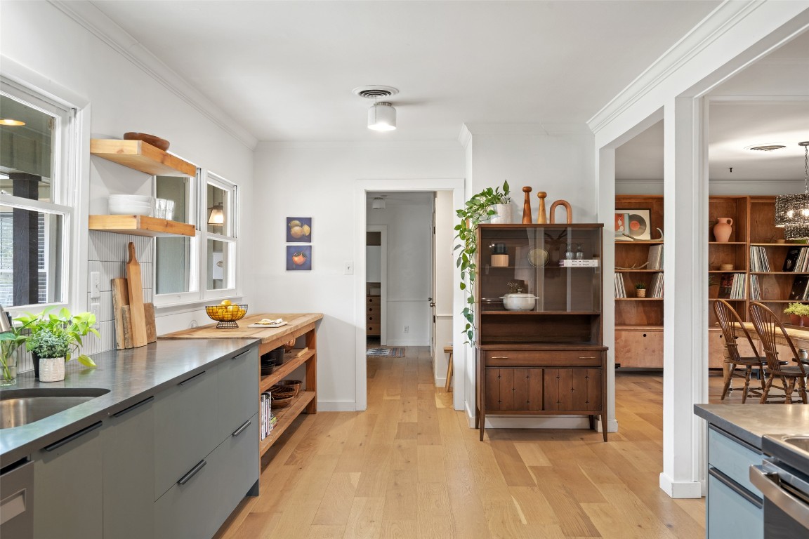 1802 Hutto Road Georgetown, TX 78626 - Photo 11 of 33 a kitchen with stainless steel appliances a sink stove and refrigerator