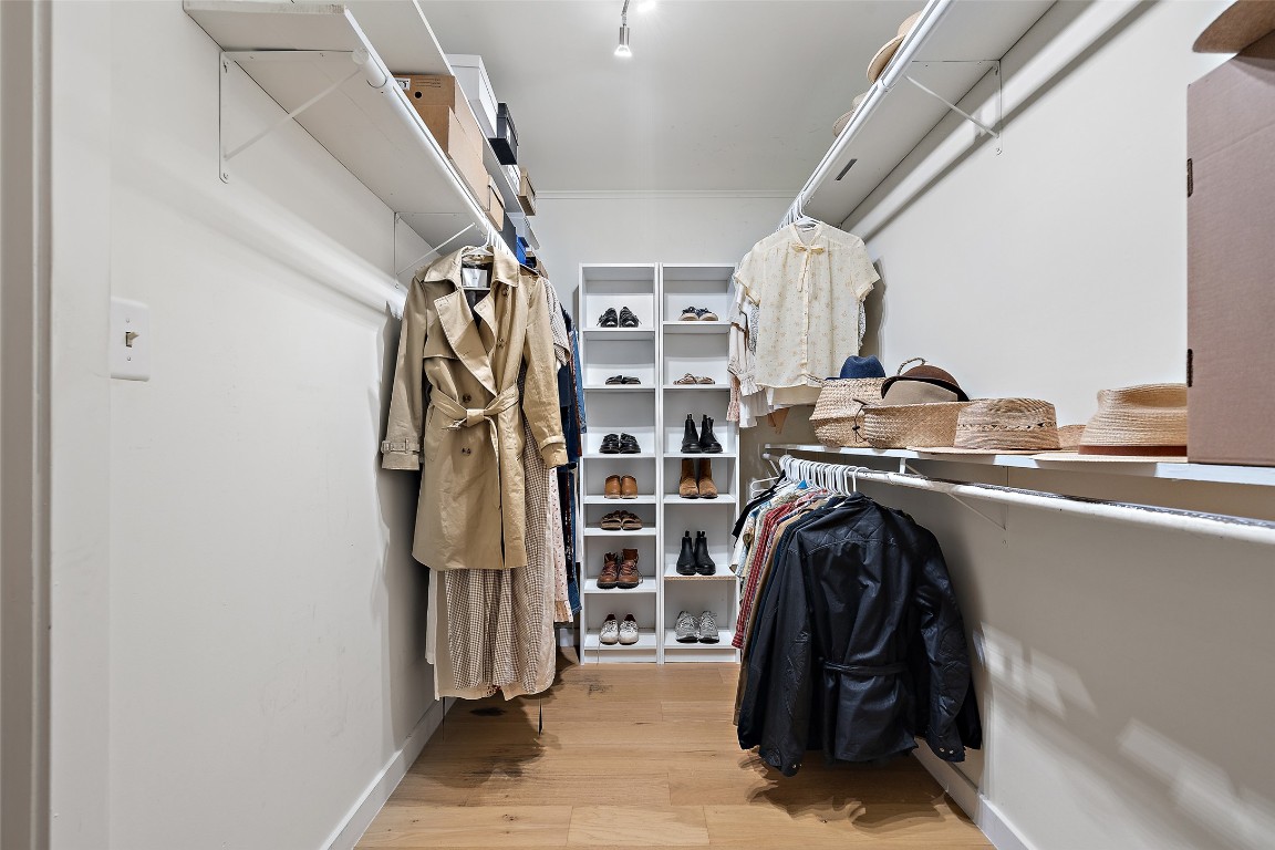 1802 Hutto Road Georgetown, TX 78626 - Photo 18 of 33 a view of walk in closet with clothes and shoes