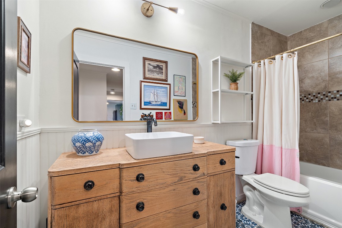 1802 Hutto Road Georgetown, TX 78626 - Photo 24 of 33 a bathroom with a sink toilet vanity and tub