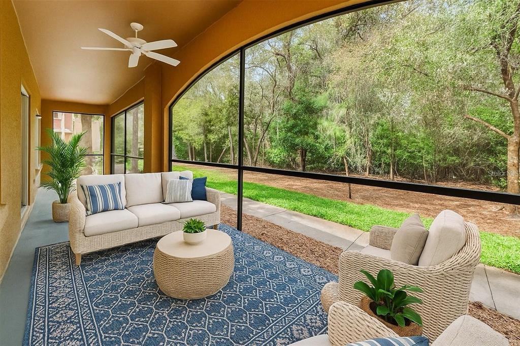 2148 Chianti Place, Unit 1310 Palm Harbor, FL 34683 - Photo 3 of 33 a living room with furniture and a floor to ceiling window