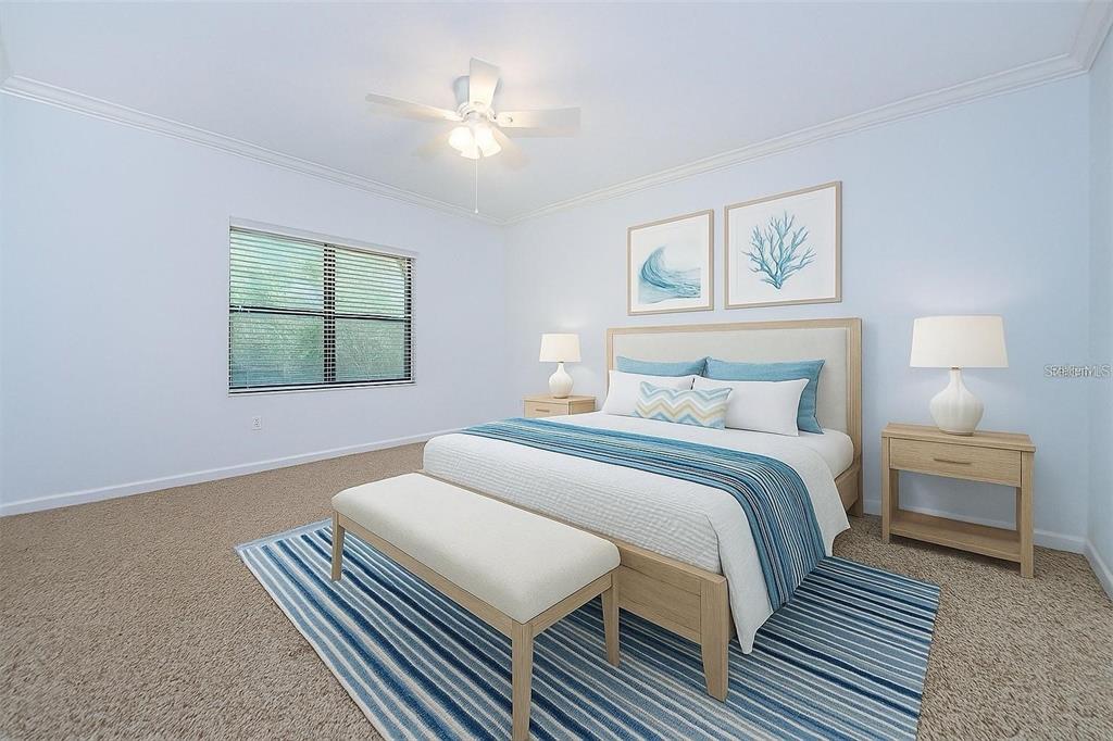 2148 Chianti Place, Unit 1310 Palm Harbor, FL 34683 - Photo 5 of 33 a bedroom with a bed and a chandelier