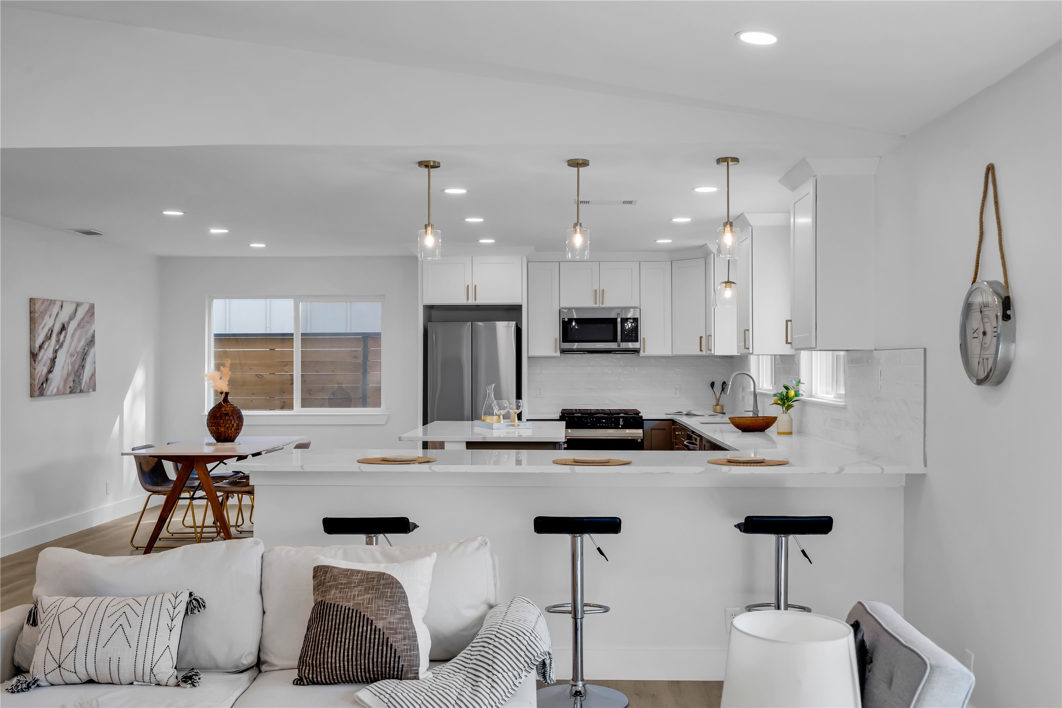 11602 Big Trail Austin, TX 78759 - Photo 9 of 27 a kitchen with stainless steel appliances kitchen island granite countertop a sink and cabinets